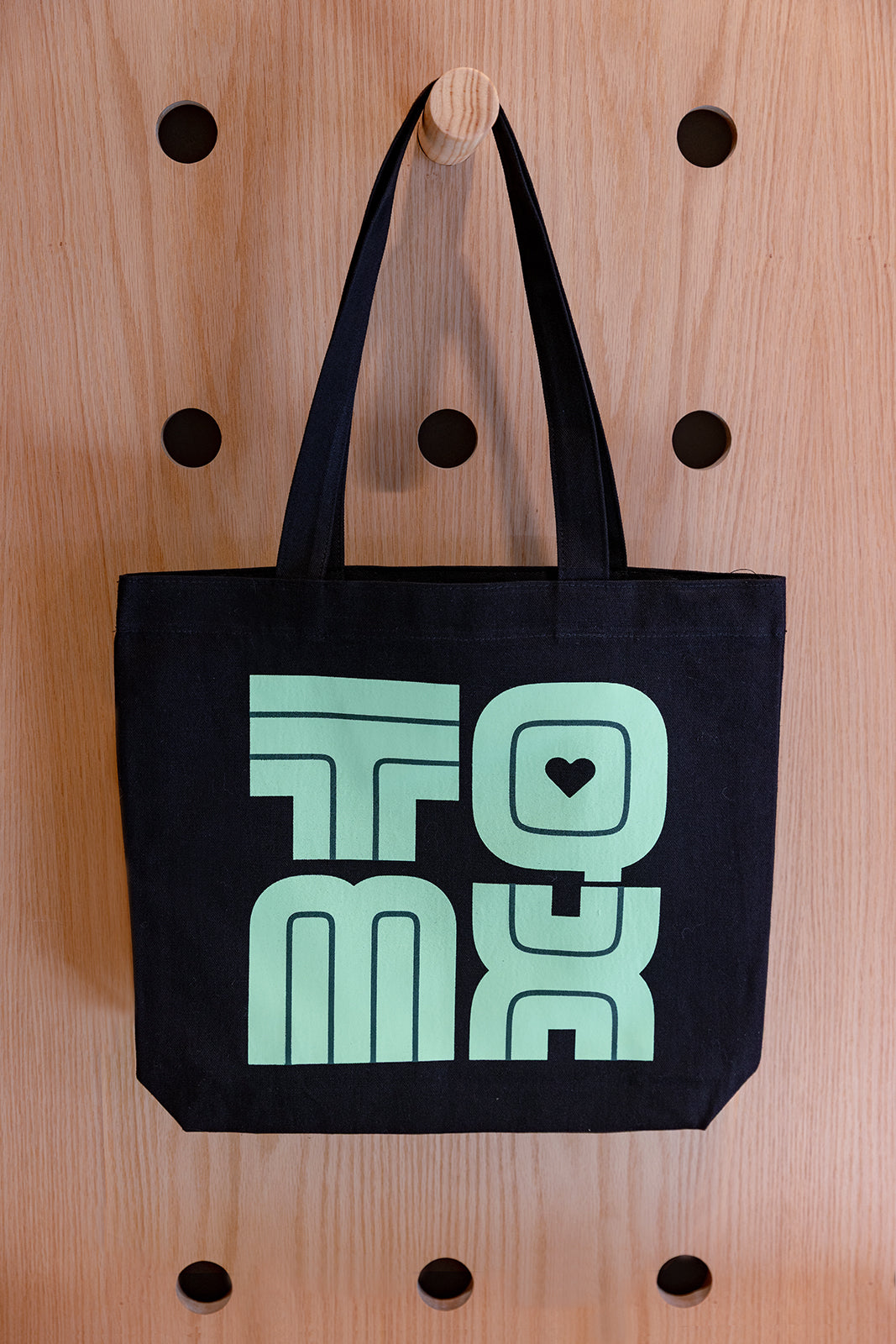 Tote negra TQMX verde aqua